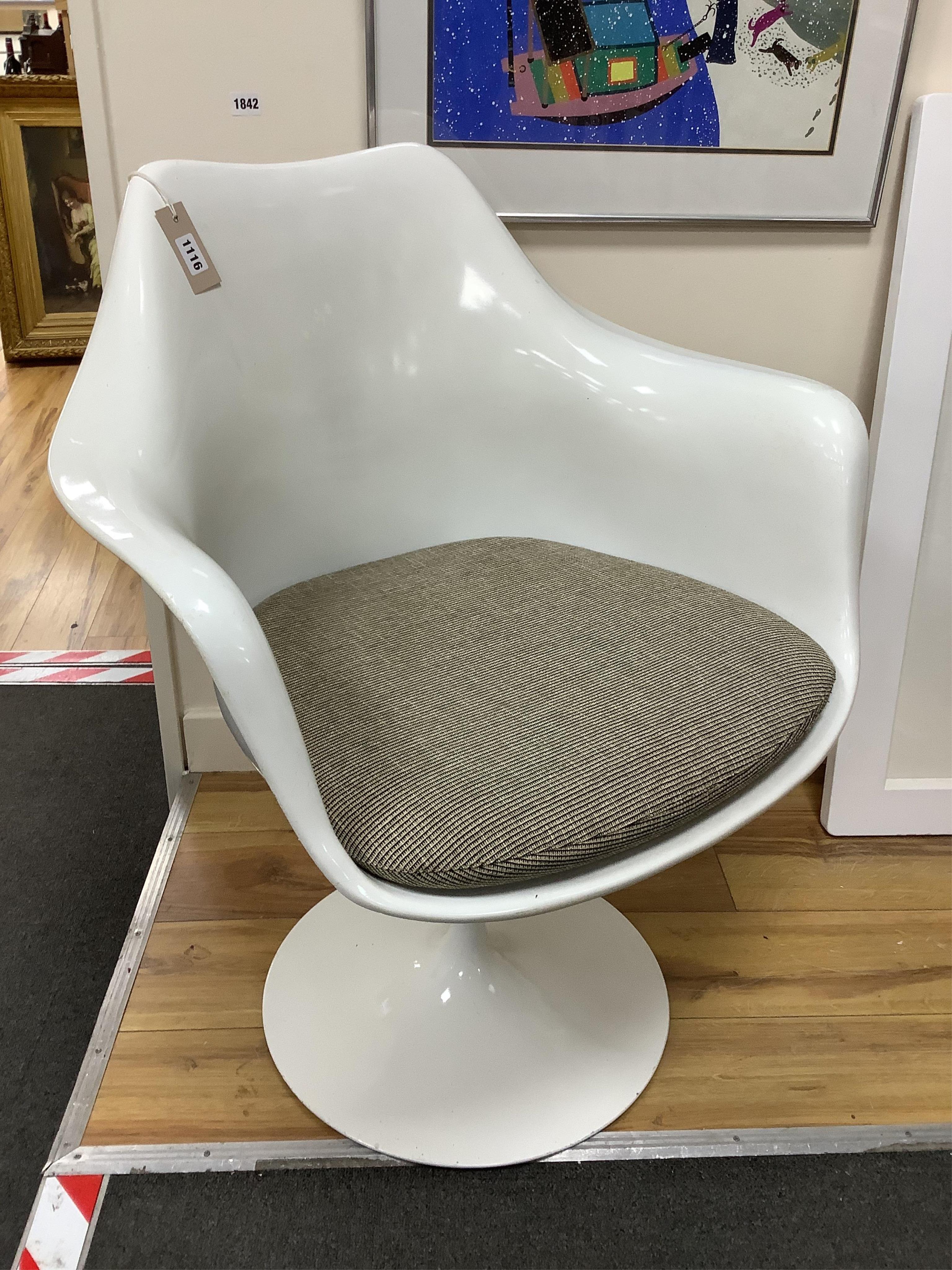 An Eero Saarinen white tulip chair, with paperwork, width 65cm, depth 54cm, height 80cm. Condition - fair